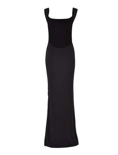 A sleek, full-length black evening gown from TIGERMIST, the MORANA DRESS - BLACK features a square neckline and wide shoulder straps. The dress boasts a fitted bodice that effortlessly transitions into a long, flowing skirt, creating an elegant and sophisticated silhouette.