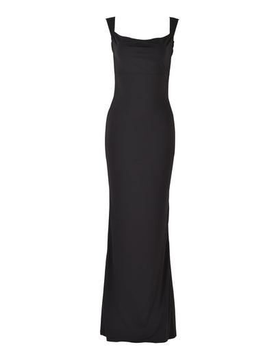 The MORANA DRESS - BLACK from TIGERMIST is a full-length evening gown featuring a fitted silhouette, sleeveless design, and cowl neckline. Its smooth, unembellished texture and floor-length hemline create an elegant and sophisticated look.