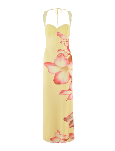 The NYOMI MAXI DRESS - YELLOW HIBISCUS by TIGERMIST is a long yellow maxi with lace bust panel, halter-neck, macro pink and white floral side print, and delicate lace detailing at the back.