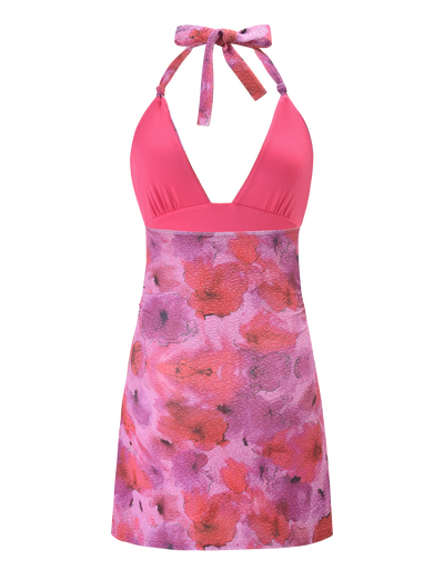 The TIGERMIST TALYN MINI DRESS - PINK SPARKLE FLORAL is a sleeveless halter A-line dress with a pink top, neck tie, and a fitted skirt in purple and pink floral print.