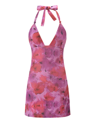 The TALYN MINI DRESS by TIGERMIST is a sleeveless, pink sparkle floral A-line dress with a deep V-neckline and a tied halter bow at the neck.
